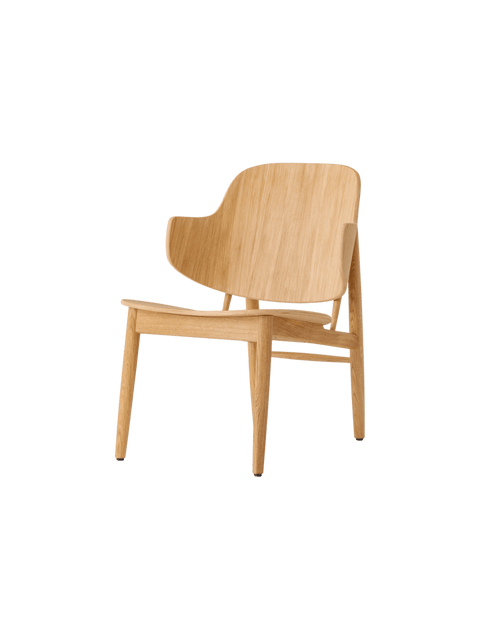 Audo Copenhagen The Penguin Wooden Lounge Chair in a styled interior