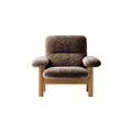 Audo Copenhagen Brasilia Lounge Chair in Natural Oak and Sheepskin Sahara, packshot on white