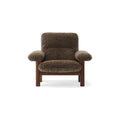 Audo Copenhagen Brasilia Lounge Chair in Dark Stained Oak with Sheepskin Root, packshot on white