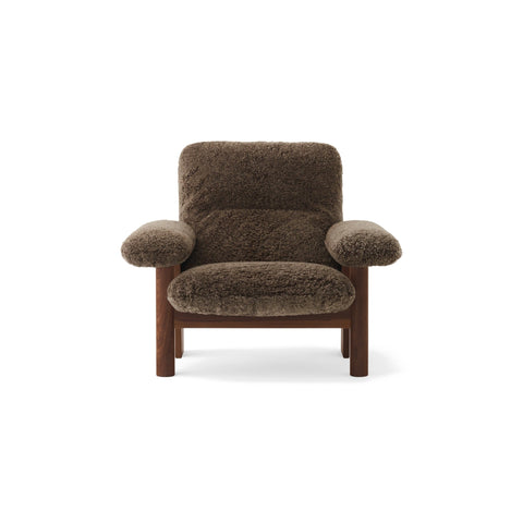 Audo Copenhagen Brasilia Lounge Chair in Dark Stained Oak with Sheepskin Root, packshot on white