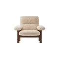 Audo Copenhagen Brasilia Lounge Chair in Dark Stained Oak and Sheepskin Natural, packshot on white