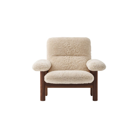 Audo Copenhagen Brasilia Lounge Chair in Dark Stained Oak and Sheepskin Natural, packshot on white