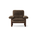 Audo Copenhagen Brasilia Lounge Chair in Walnut with Sheepskin Root, packshot on white