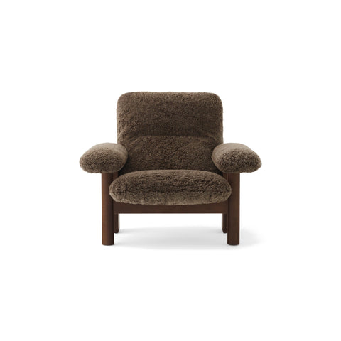 Audo Copenhagen Brasilia Lounge Chair in Walnut with Sheepskin Root, packshot on white
