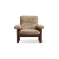 Audo Copenhagen Brasilia Lounge Chair in Walnut with Sheepskin Sahara, packshot on white
