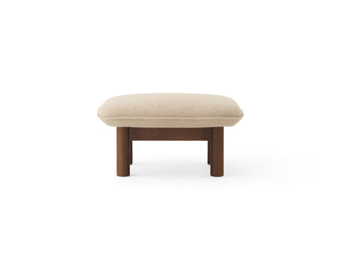 brasilia lounge ottoman with dark stained base and boucle fabric designed by Anderssen & Voll for audo copenhagen