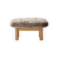 Audo Copenhagen Brasilia Ottoman in Natural Oak and Sheepskin Root, packshot on white