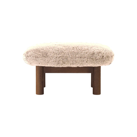 Audo Copenhagen Brasilia Ottoman in Dark Stained Oak and Sheepskin Natural, packshot on white