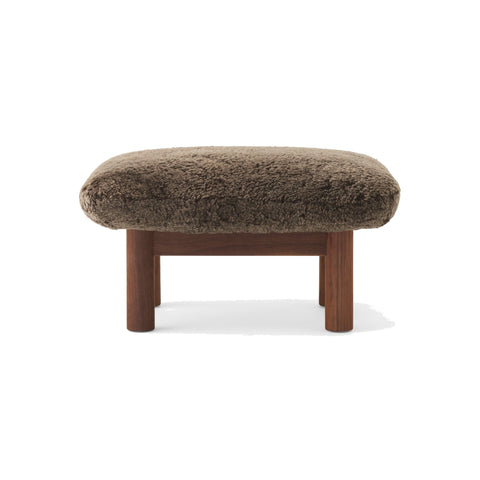 Audo Copenhagen Brasilia Ottoman in Walnut with Sheepskin Root, packshot on white