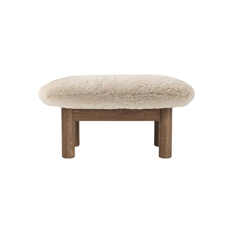 Audo Copenhagen Brasilia Ottoman in Walnut and Sheepskin Natural, packshot on white