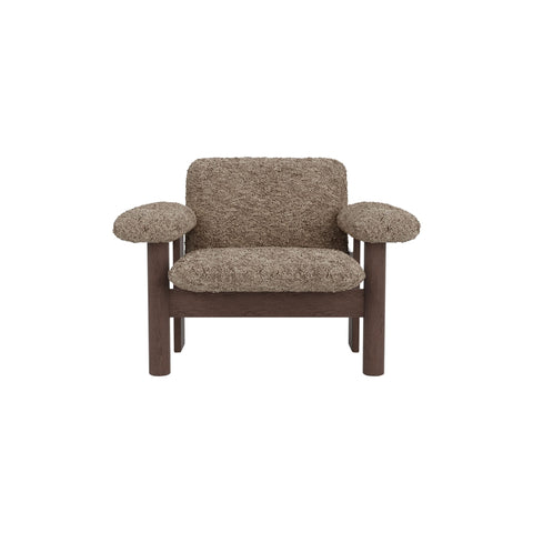 Audo Copenhagen Brasilia Lounge Chair, Low Back in Dark Stained Oak with Sheepskin Sahara, packshot on white