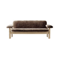Audo Copenhagen Brasilia Sofa in Natural Oak with Sheepskin Root, packshot on white