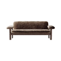 Audo Copenhagen Brasilia Sofa in Dark Stained Oak with Sheepskin Root, packshot on white