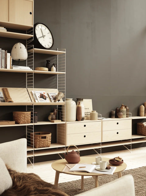 Oak String® System chest of drawers with two drawers in a Scandinavian living room shelving unit