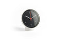 HAY Table Clock, Black, black dial table clock, white case and pedestal base with white hands and a red second hand, on plain white