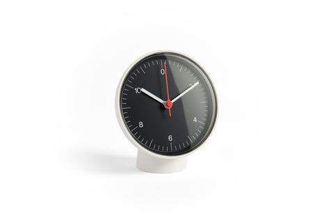 HAY Table Clock, Black, black dial table clock, white case and pedestal base with white hands and a red second hand, on plain white