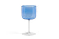 HAY Tint Wine Glasses, Blue, tinted borosilicate wine glasses, one blue bowled glass with a clear stem on a plain white background