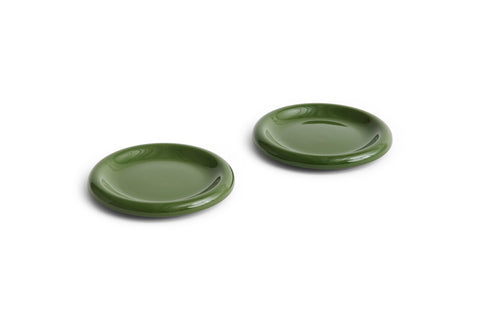 HAY Barro Plates, Ø18, Green, glazed terracotta side plates in olive green, two shown at an angle on plain white