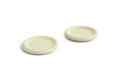 HAY Barro Plates, Ø18, Pistachio, glazed terracotta side plates in pale green, two shown at an angle on plain white