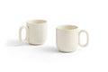 HAY Barro Cups, Off-White, terracotta cups, two cream glazed cups with loop handles on a plain white background