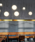 aj eklipta wall lamp designed by arne jacobsen for louis poulsen in a restaurant 