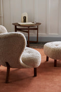 Styled living room with Little Petra VB1 lounge chair and ottoman by &Tradition, featuring warm Scandinavian tones.