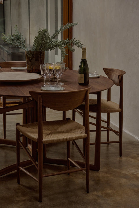 Close-up of Drawn HM3 Chair in walnut with woven paper cord seat by &Tradition – Danish modern dining design by Hvidt & Mølgaard