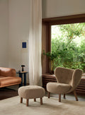 Scandinavian interior with Little Petra VB1 chair and Pouf by &Tradition beside the Inland sofa and modern decor.