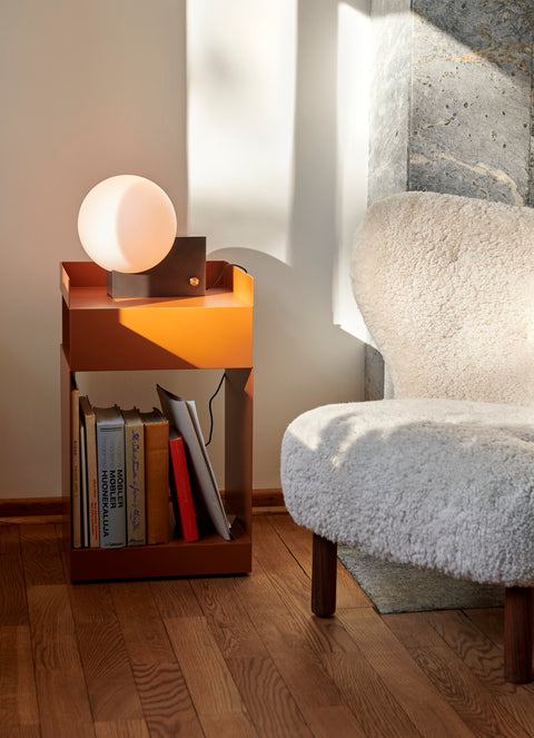 Little Petra VB1 lounge chair by &Tradition next to Rotate side table and Journey lamp in minimalist Scandinavian setting.
