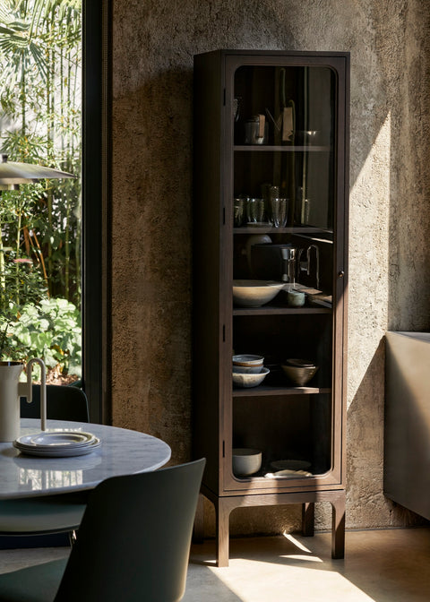 Trace SC87 Cabinet by &Tradition in dark-stained oak styled with ceramics and glassware in a Scandinavian-inspired interior with natural light.