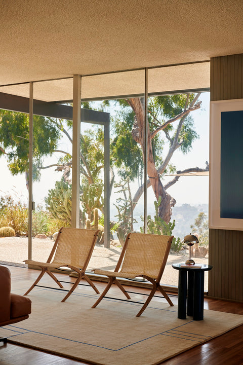 Two X HM10 Chairs by &Tradition with Flowerpot VP9 lamp on Tung JA3 side table over Cruise AP12 rug in a bright view filled living room