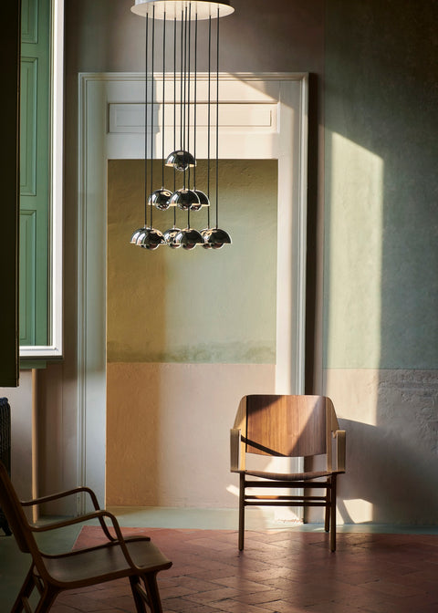 AX HM11 Lounge Chair by &Tradition in oak and walnut beneath Flowerpot VP10 chandelier in contemporary setting