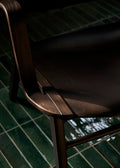 Detail shot of AX HM11 Lounge Chair by &Tradition in dark stained oak, designed by Hvidt & Mølgaard