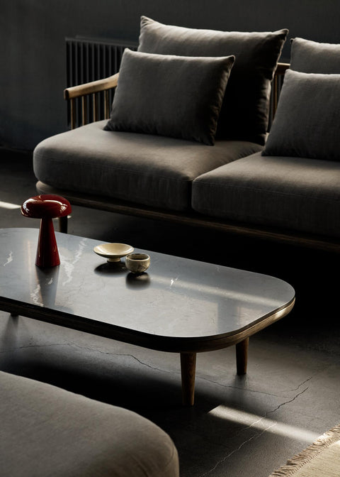 Fly SC5 coffee table by &Tradition with smoked oak frame and Nero Marquina marble top, paired with the Fly SC2 sofa and Como SC53 lamp.