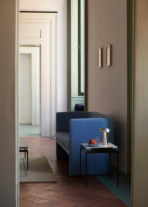 Sett LN11 End Table by &Tradition in Bianco Carrara Marble with Dark Chrome Frame beside Loafer SC25 Lounge Chair and Cruise AP12 Rug