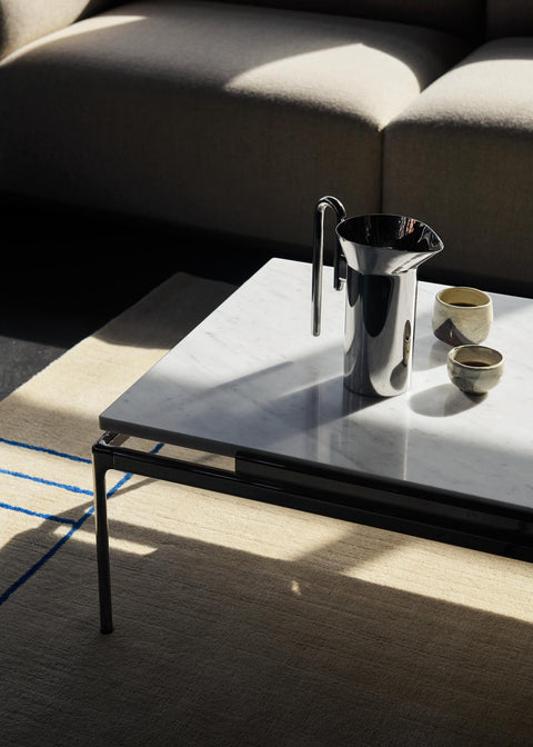 Sett LN12 Coffee Table by &Tradition in Bianco Carrara Marble with Dark Chrome Frame paired with Momento Jug JH38 and Cruise AP12 Rug