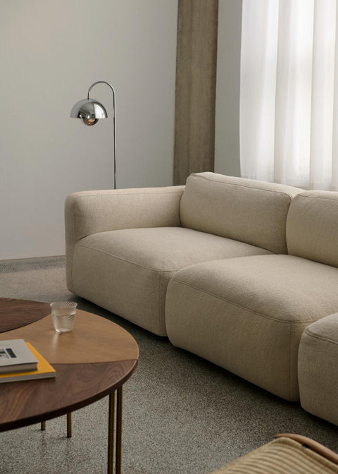 &Tradition Flowerpot VP12 Floor Lamp in Chrome illuminating a calm neutral living room with the Develius Mellow Sofa by &Tradition.