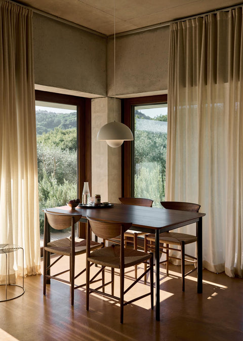 Modern dining area with Drawn HM3 Chairs in walnut by &Tradition, designed by Hvidt & Mølgaard – Scandinavian mid-century dining furniture