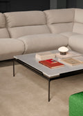Sett LN13 Coffee Table in Bianco Carrara Marble by &Tradition beside the HiLo Sofa and Mist Lamp in a modern living space