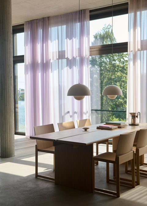 Set of Allwood AV35 Dining Chairs by &Tradition in oak against a concrete wall for a minimal Scandinavian look