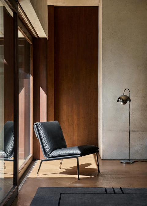 &Tradition Flowerpot VP12 Floor Lamp in Cobalt Blue adding a pop of colour to a warm, wood-clad interior with soft neutral furnishings.