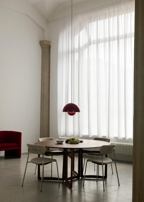Drop Leaf HM6 table in walnut by &Tradition in modern dining room with red Flowerpot pendant and neutral chairs