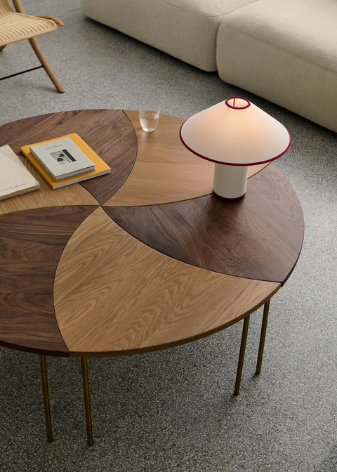 Cluster of &Tradition Pinwheel HM7 End Tables in walnut and oak forming circular coffee table arrangement