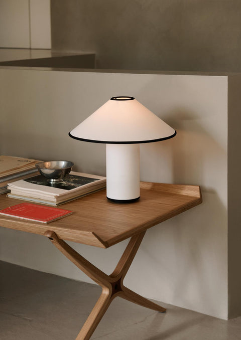 Detail of X HM13 Coffee Table by &Tradition with a modern lamp and books, Scandinavian oak coffee table close-up