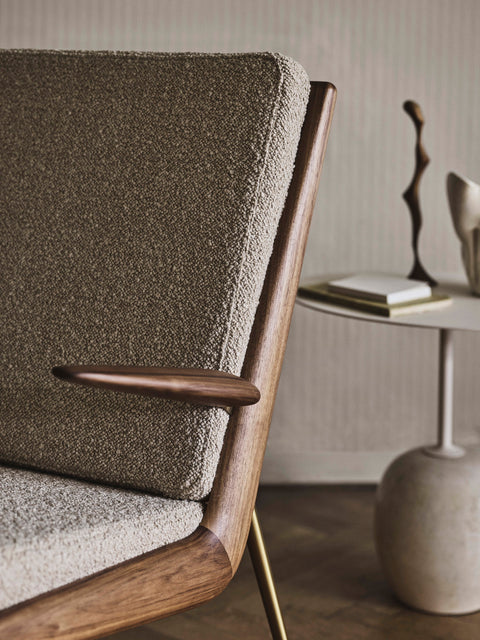 Armrest and upholstery detail of &Tradition Boomerang HM2 Lounge Chair by Hvidt & Mølgaard in boucle fabric