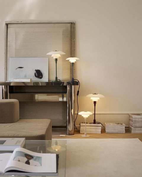 Louis Poulsen PH 3/2 and PH 2/1 Table Lamps in the new glossy colours, grouped on a sideboard and side table in a warm neutral living room