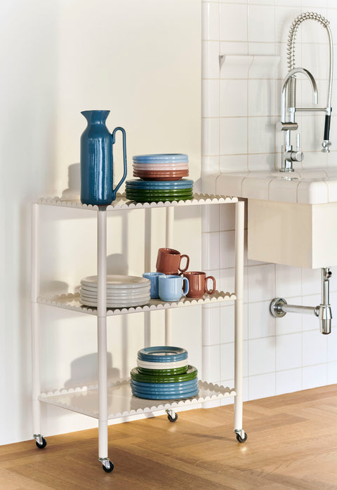 HAY Barro Cups, Light Blue, terracotta cups, blue and terracotta cups on a cream trolley of stacked plates in a white tiled kitchen