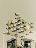 HAY Italian Ice Cup, Stainless Steel, stainless steel ice cream cup, many cups holding pears and lemons on a cream scalloped trolley