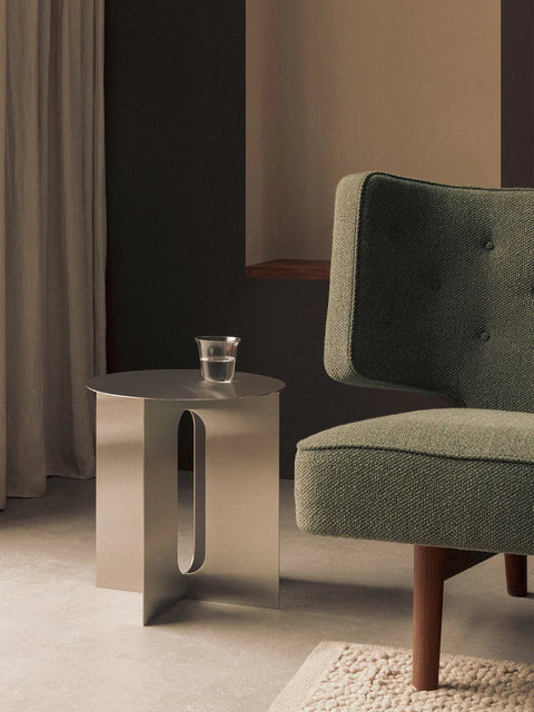 Danielle Siggerud side table in brushed steel in a scandinavian living room designed by audo copenhagen