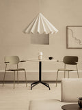 Audo Copenhagen Co Dining Chair, Outdoor, olive Co Dining Chairs with armrests at a Harbour Column Table, Dancing Pendant, Torso Table Lamp and a Branch Side Table